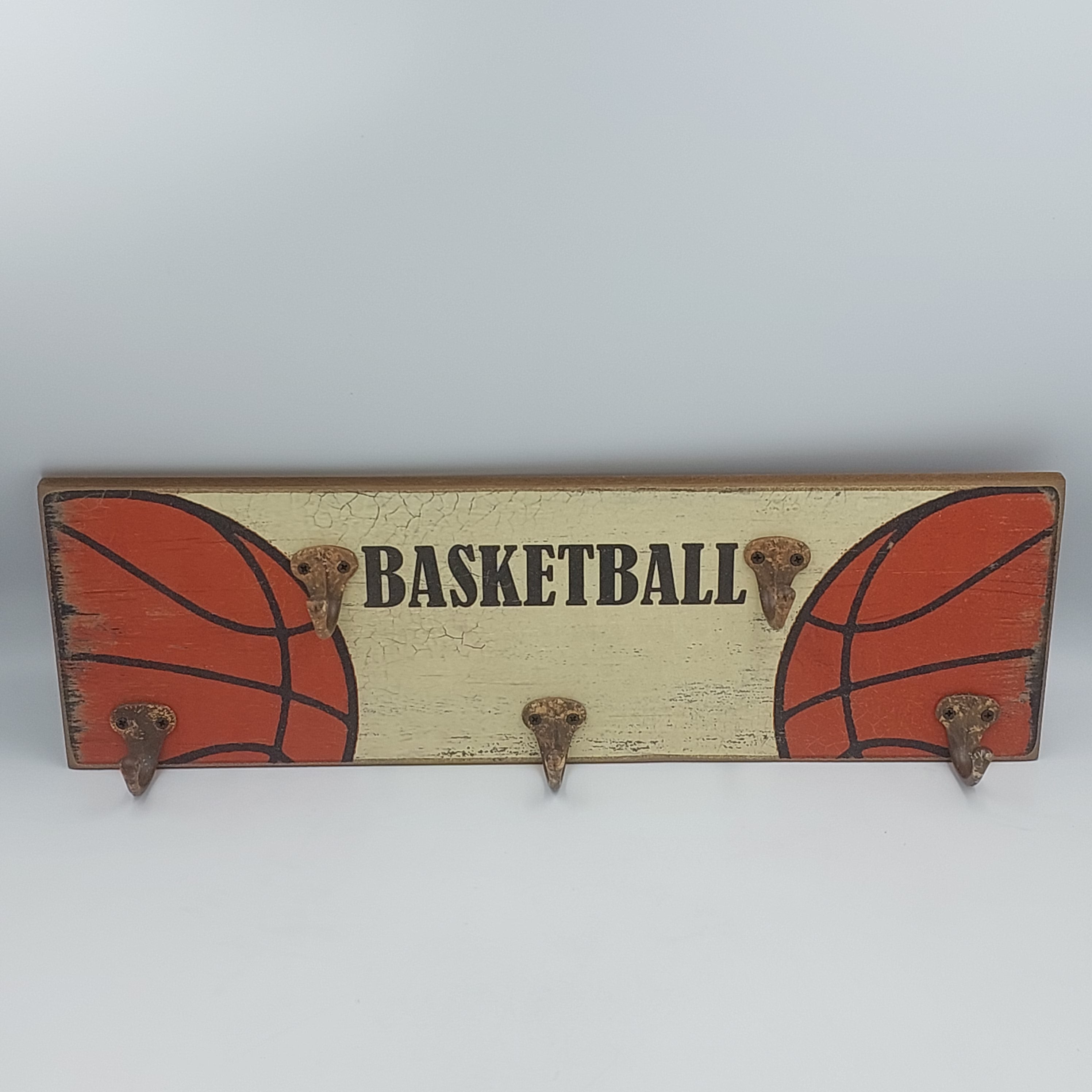 Basketball sign with coat hooks